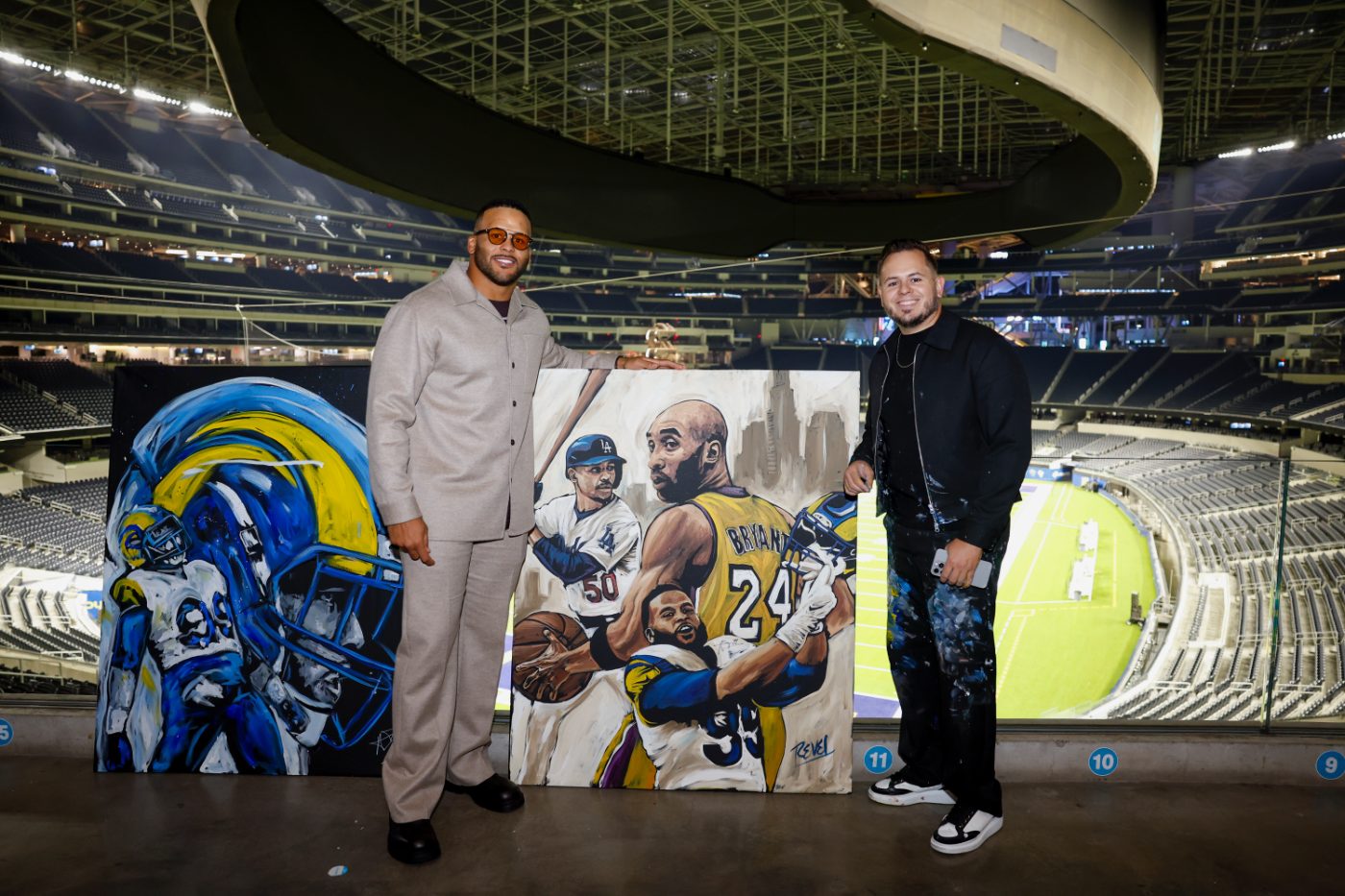 Revel painting live at a halftime show in front of thousands of fans