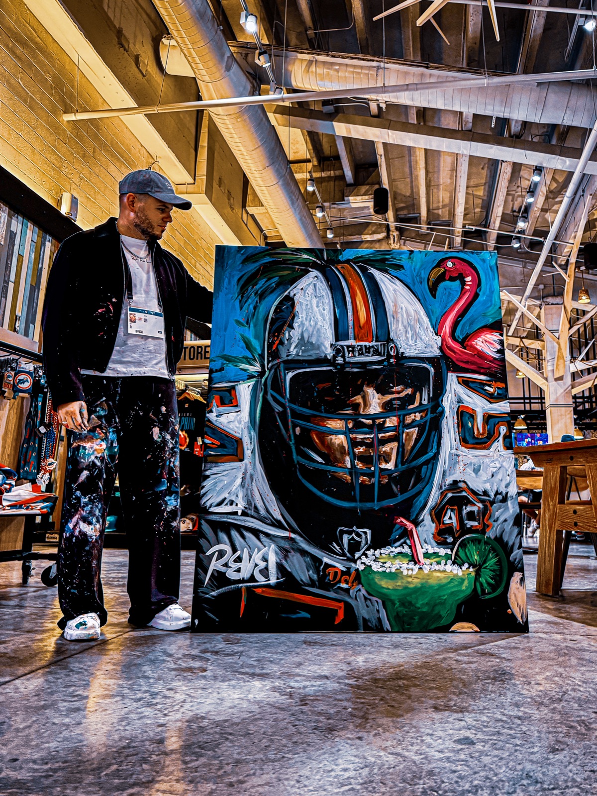 Revel performing a live speed painting at a halftime show