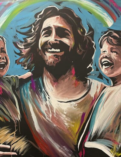 Jesus holding up children on his arms as they laugh together